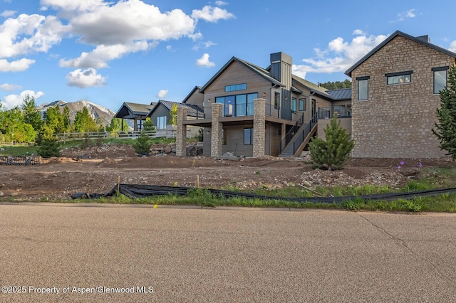 112 Bowles Dr, Carbondale, CO 81623 - rear view of property featuring stairway and a chimney