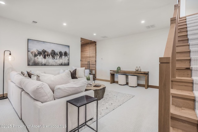 112 Bowles Dr, Carbondale, CO 81623 - living area with stairway, recessed lighting, light carpet, and baseboards