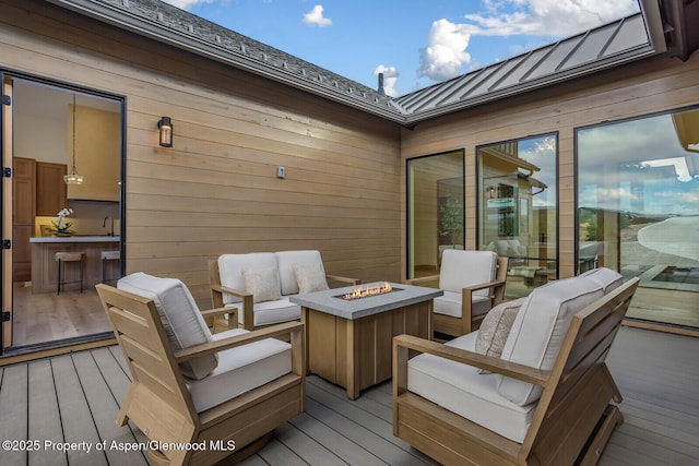 112 Bowles Dr, Carbondale, CO 81623 - wooden deck featuring an outdoor living space with a fire pit and a sink