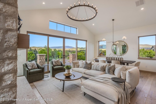 112 Bowles Dr, Carbondale, CO 81623 - living room featuring a chandelier, high vaulted ceiling, wood-type flooring, recessed lighting, and baseboards