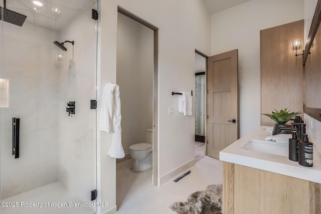 112 Bowles Dr, Carbondale, CO 81623 - bathroom with toilet, a stall shower, and double vanity