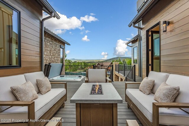 112 Bowles Dr, Carbondale, CO 81623 - wooden terrace featuring an outdoor living space with a fire pit and a mountain view