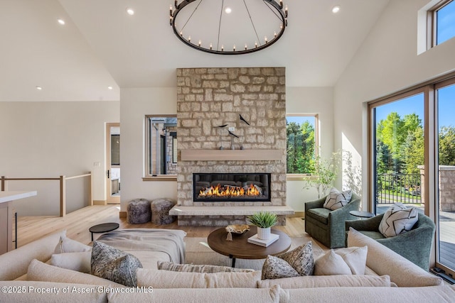 112 Bowles Dr, Carbondale, CO 81623 - living area with a chandelier, wood finished floors, high vaulted ceiling, recessed lighting, and a fireplace
