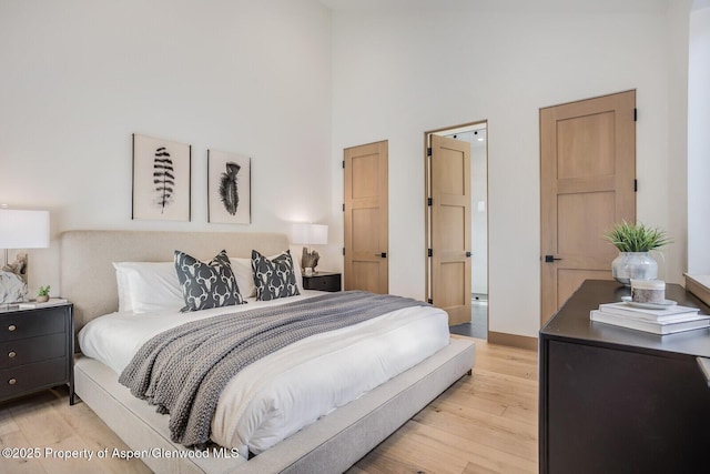 112 Bowles Dr, Carbondale, CO 81623 - bedroom with a high ceiling and light wood finished floors