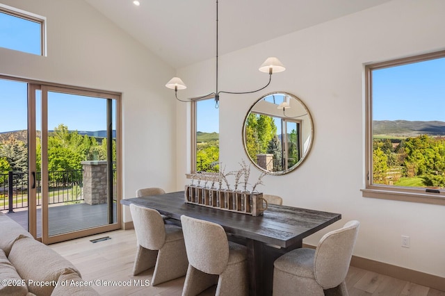 112 Bowles Dr, Carbondale, CO 81623 - dining room featuring light wood-type flooring, a mountain view, high vaulted ceiling, baseboards, and recessed lighting