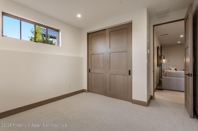 112 Bowles Dr, Carbondale, CO 81623 - unfurnished bedroom featuring carpet floors, a closet, baseboards, and recessed lighting