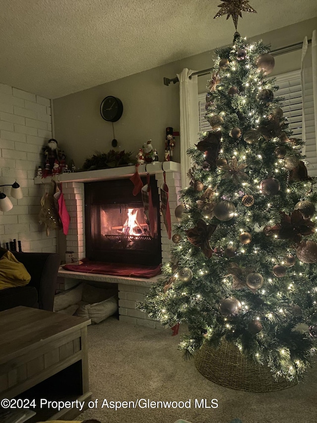 interior details with a fireplace and a textured ceiling