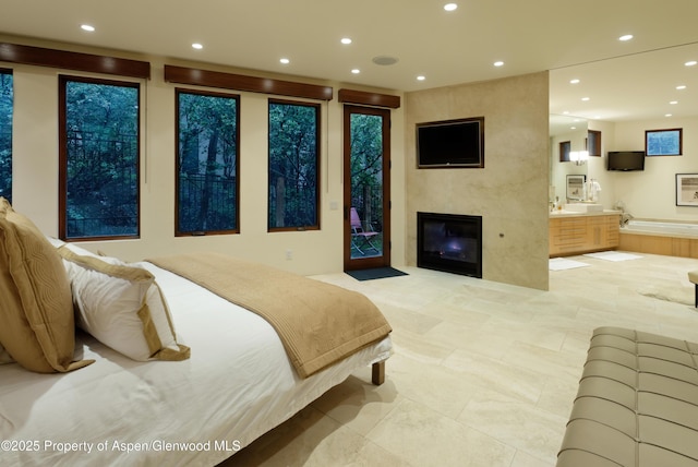 71 Smuggler Grv, Aspen, CO 81611 - bedroom with recessed lighting, access to exterior, a large fireplace, and ensuite bath
