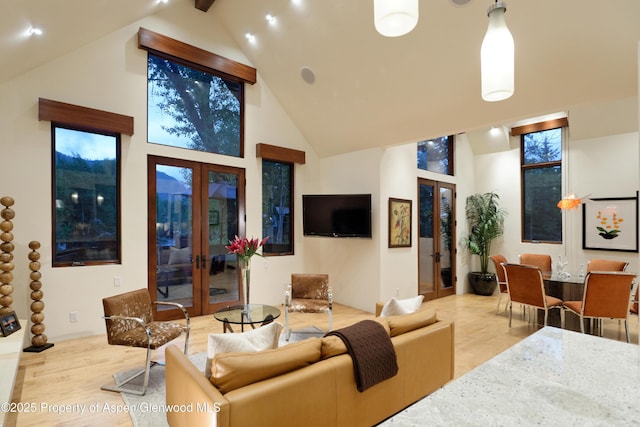 71 Smuggler Grv, Aspen, CO 81611 - living area featuring french doors, high vaulted ceiling, and beam ceiling