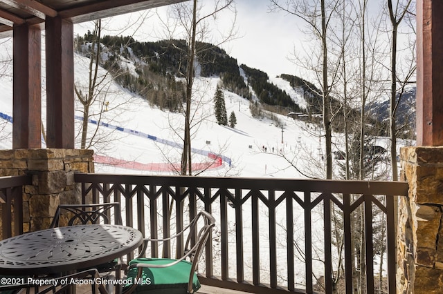 0197 Prospector Rd Unit 2412Summer Interest, Aspen, CO 81611 - snow covered back of property featuring a mountain view