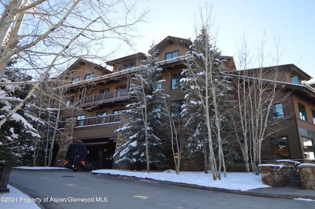 0197 Prospector Rd Unit 2412Summer Interest, Aspen, CO 81611 - snow covered property featuring a view of apartment building / complex
