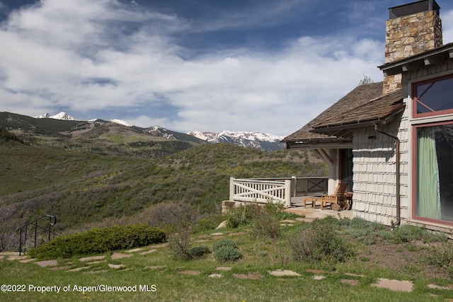 800 Chateau Way, Snowmass, CO 81654 - view of yard featuring a deck with mountain view
