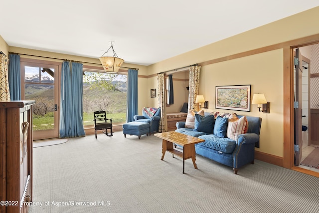800 Chateau Way, Snowmass, CO 81654 - living room with carpet floors and a notable chandelier
