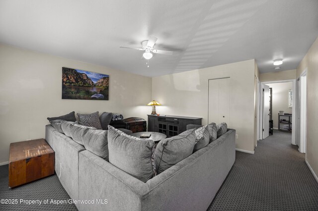 693 N 7th St, Silt, CO 81652 - living room featuring carpet flooring, baseboards, and a ceiling fan