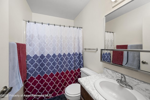 693 N 7th St, Silt, CO 81652 - full bathroom with a shower with shower curtain, vanity, and toilet