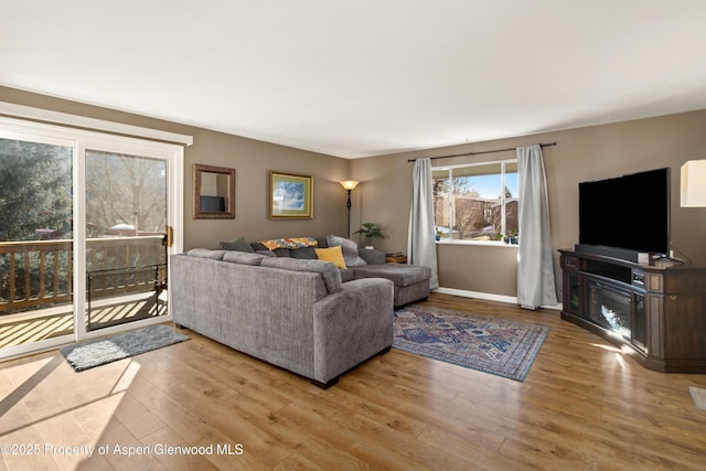 living room featuring baseboards and wood finished floors