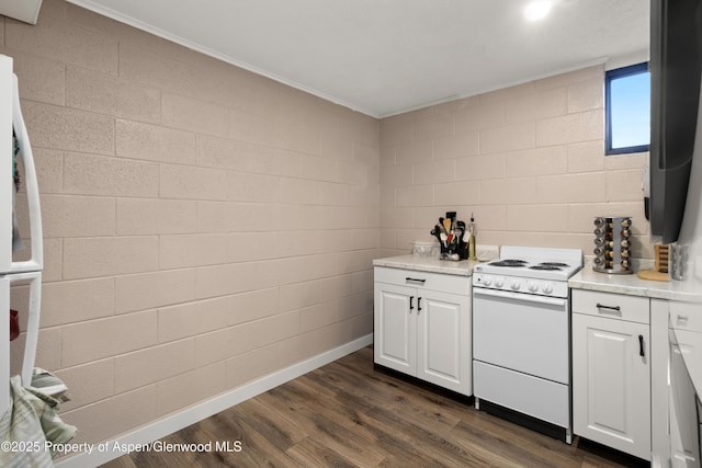 kitchen featuring white electric range oven, baseboards, dark wood finished floors, light countertops, and white cabinetry