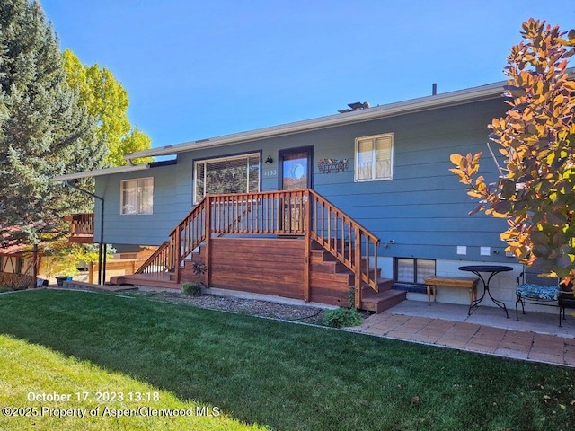 1133 Red Mountain Dr, Glenwood Springs, CO 81601 - back of house featuring a lawn and stairway