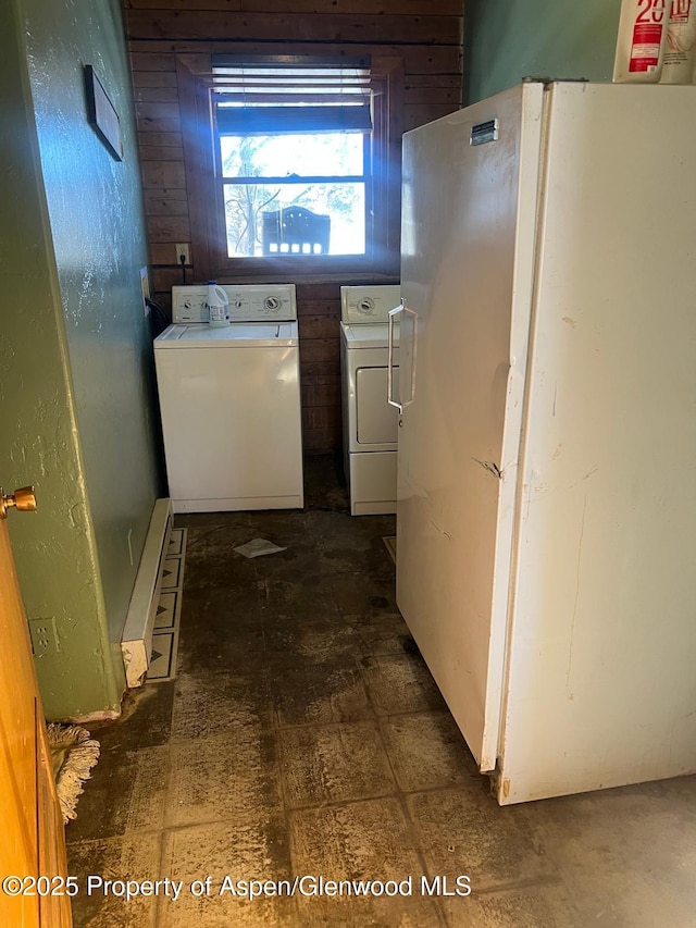 kitchen with white fridge and washing machine and clothes dryer