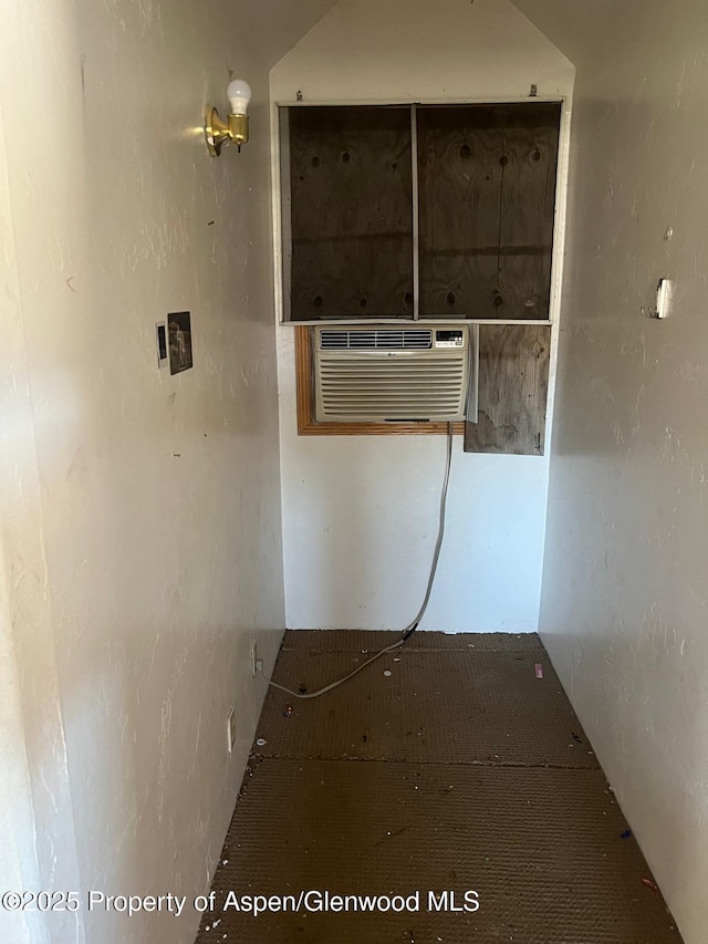 hallway with an AC wall unit