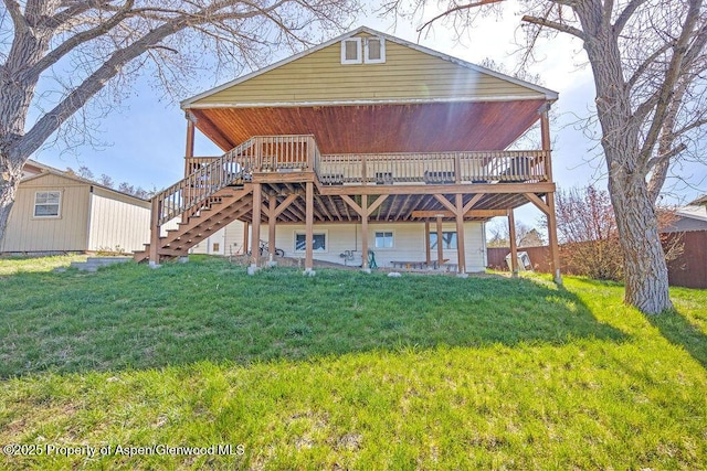 830 Exmoor Rd, Craig, CO 81625 - back of house with a deck, stairway, and a lawn