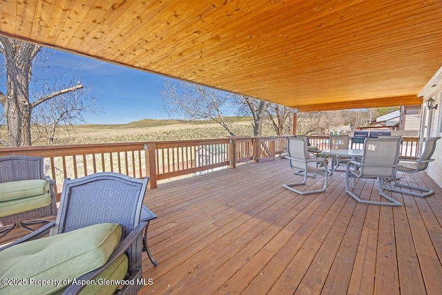 830 Exmoor Rd, Craig, CO 81625 - wooden deck with outdoor dining space and a mountain view