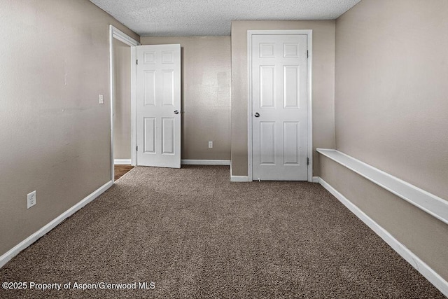 830 Exmoor Rd, Craig, CO 81625 - unfurnished bedroom with carpet flooring and a textured ceiling
