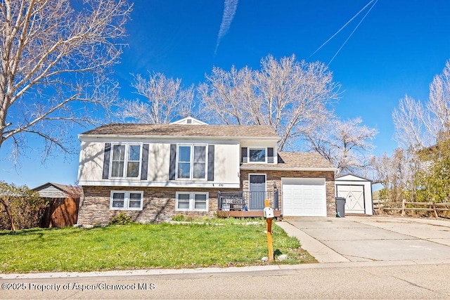 830 Exmoor Rd, Craig, CO 81625 - view of front of property featuring a garage, driveway, and stone siding
