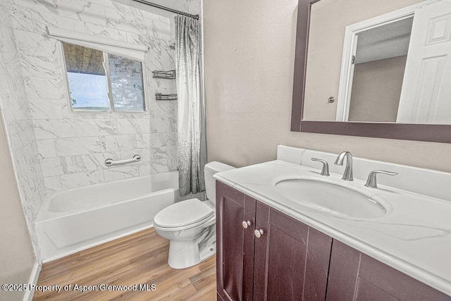 830 Exmoor Rd, Craig, CO 81625 - bathroom featuring toilet, shower / bathtub combination with curtain, vanity, and wood finished floors