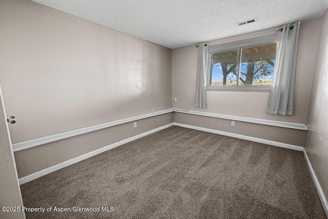 830 Exmoor Rd, Craig, CO 81625 - carpeted empty room with a textured ceiling and baseboards