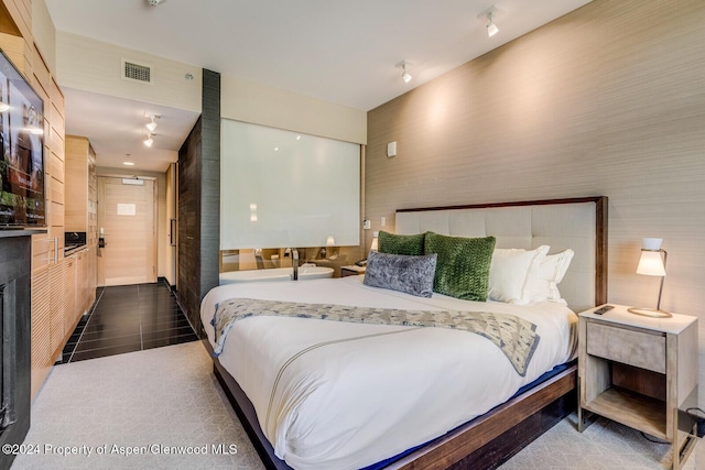 bedroom featuring dark tile patterned flooring