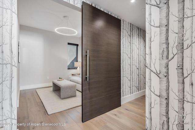 bathroom featuring wood finished floors and baseboards