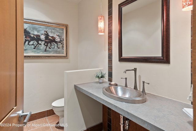 bathroom with tile patterned floors, sink, and toilet