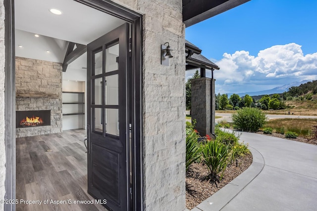 21 Tellico Ct, Carbondale, CO 81623 - property entrance with an outdoor stone fireplace and stone siding