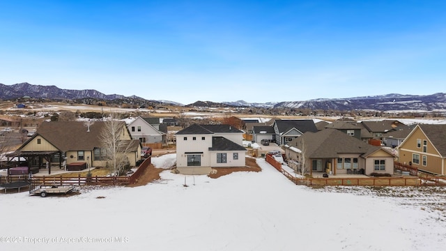 snowy aerial view featuring a mountain view