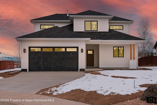 view of front of property with a garage