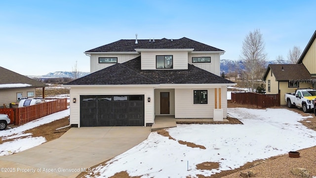 view of front of house featuring a mountain view and a garage