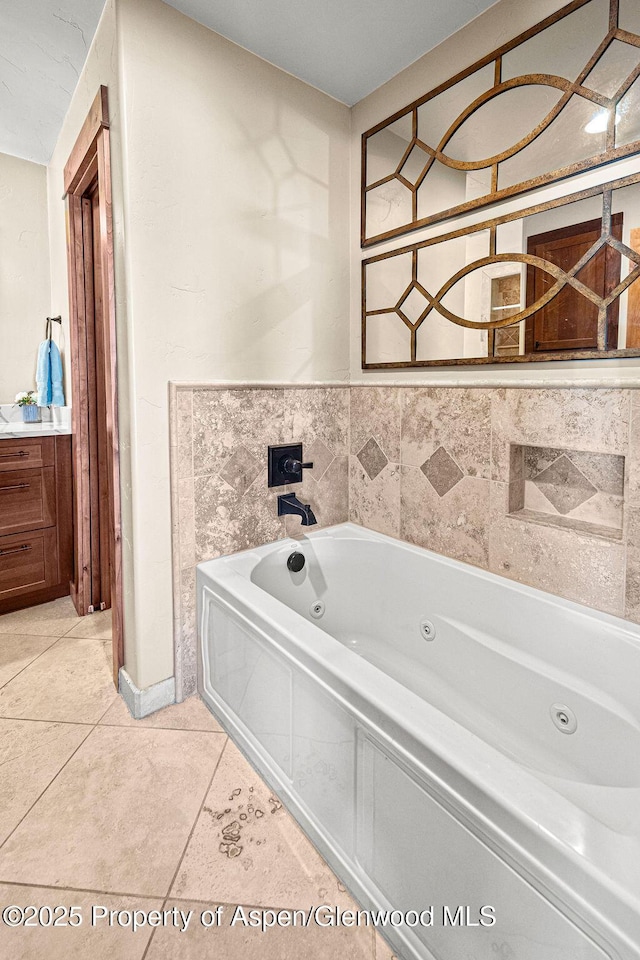 949 Breeze St, Craig, CO 81625 - bathroom featuring a tub with jets and tile patterned floors