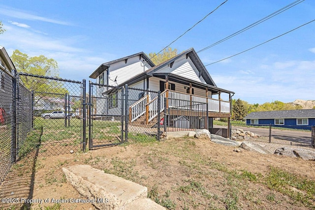 949 Breeze St, Craig, CO 81625 - back of house with a gate and covered porch