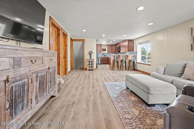 949 Breeze St, Craig, CO 81625 - living area with light wood-style flooring, recessed lighting, and baseboards