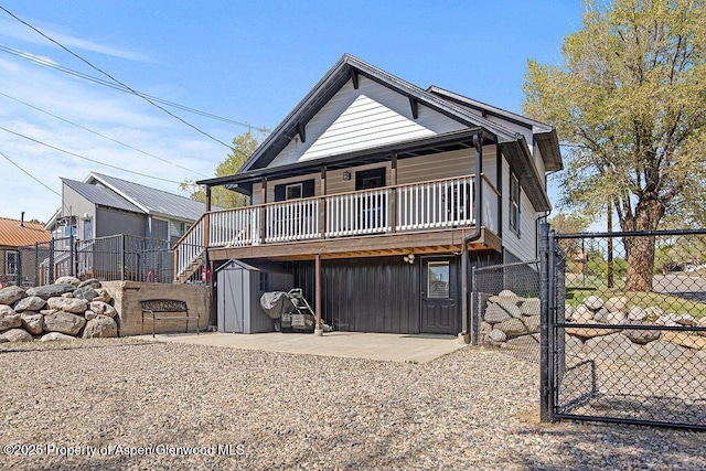 949 Breeze St, Craig, CO 81625 - view of front of house featuring stairway, a gate, and a patio area
