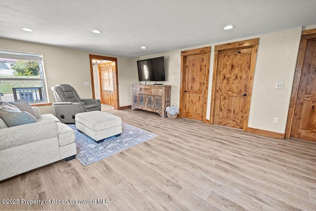 949 Breeze St, Craig, CO 81625 - living room featuring wood finished floors, recessed lighting, and baseboards