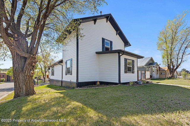 949 Breeze St, Craig, CO 81625 - view of side of home with a lawn