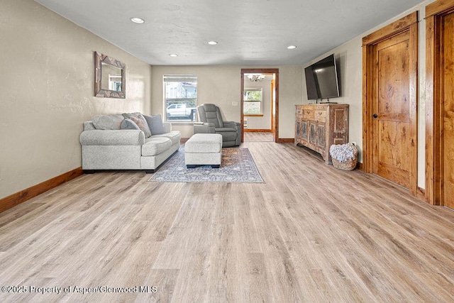 949 Breeze St, Craig, CO 81625 - living area featuring baseboards, light wood-style floors, and recessed lighting