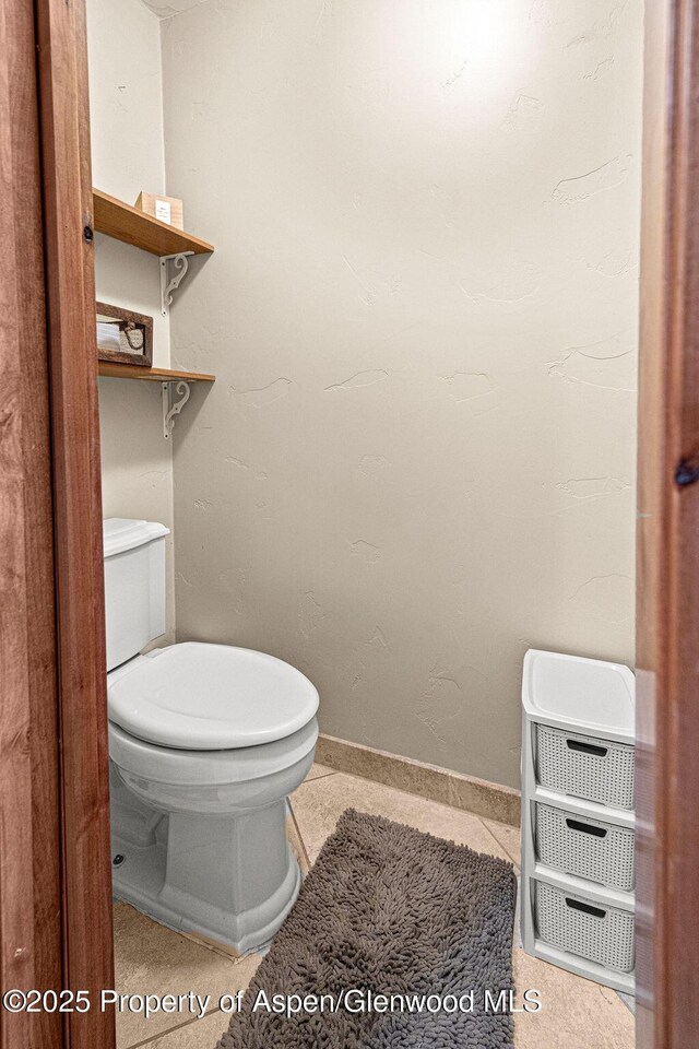 949 Breeze St, Craig, CO 81625 - bathroom with toilet, heating unit, and baseboards