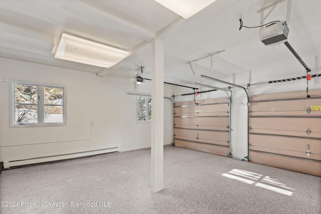 garage with baseboard heating and a garage door opener