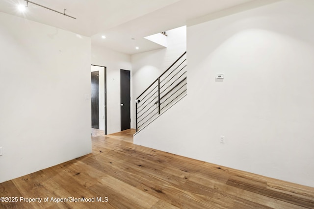 2635 Dolores Way, Carbondale, CO 81623 - unfurnished room featuring light wood finished floors, recessed lighting, a skylight, and stairway