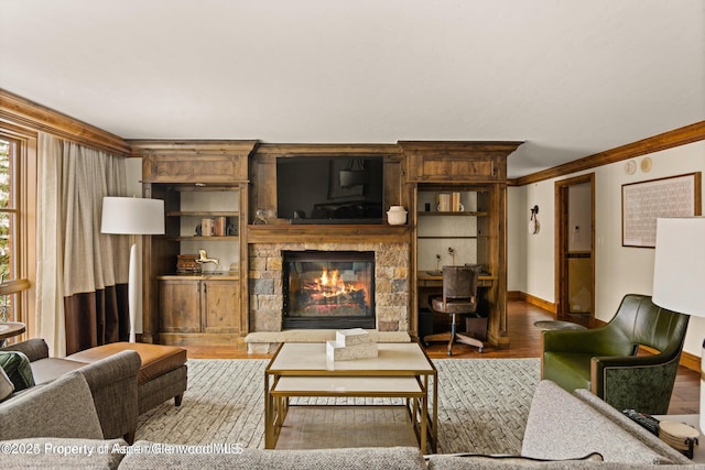 315 E Dean St Unit B30, Aspen, CO 81611 - living area with wood finished floors, a stone fireplace, and crown molding