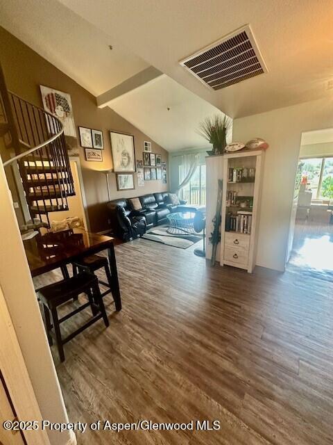 796 Castle Valley Blvd Unit J, New Castle, CO 81647 - dining room featuring wood finished floors and stairs