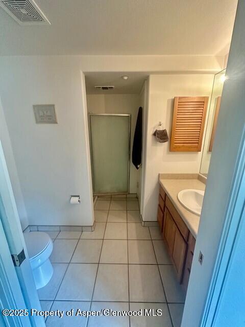 796 Castle Valley Blvd Unit J, New Castle, CO 81647 - bathroom featuring vanity, toilet, and tile patterned floors